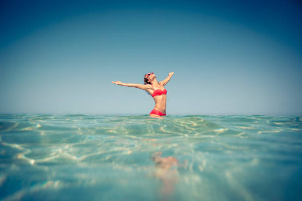 istock Young woman in the sea 980341708
