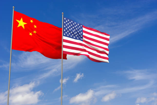 istock China and USA flags over blue sky background. 3D illustration 980343196