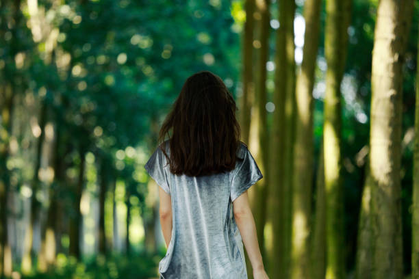 istock Young woman in the forest 980358710