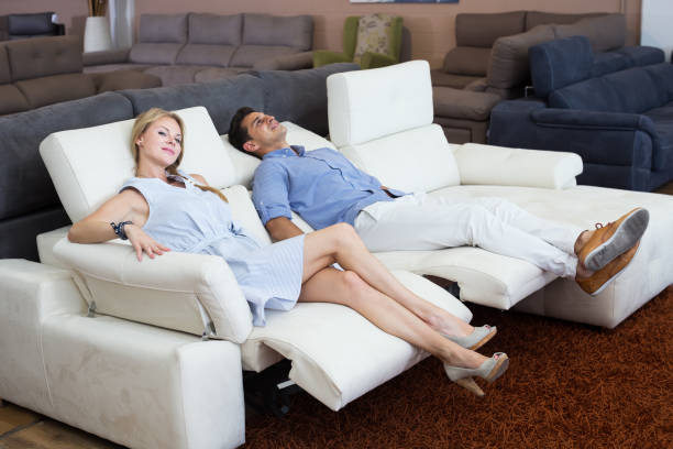 istock Customers are choosing of sofa with a rising bottom 980361048