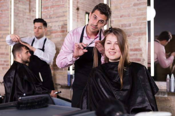 istock Brunette getting haircutting in salon 980403106