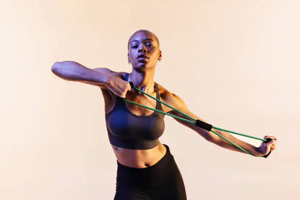 Photo of Portrait of a young girl stretching a resistance band