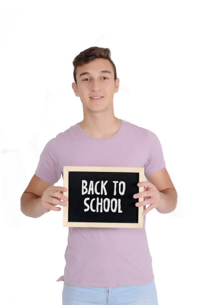 istock Young man holding chalkboard with text 