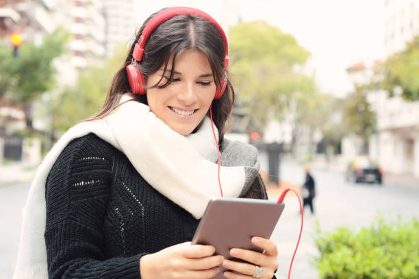 istock Portrait of a young woman using her tablet. 980408488