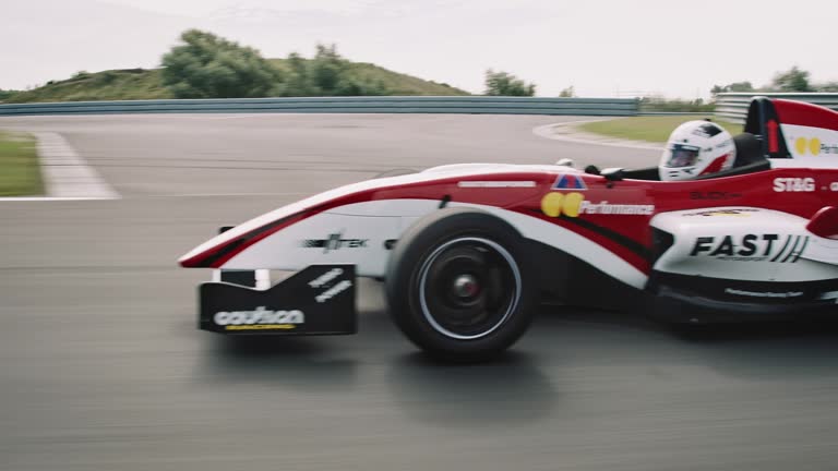 Formular one racing car driving on a racetrack