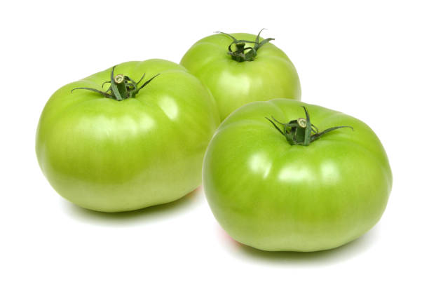 istock Studio shot of green tomato 980411884