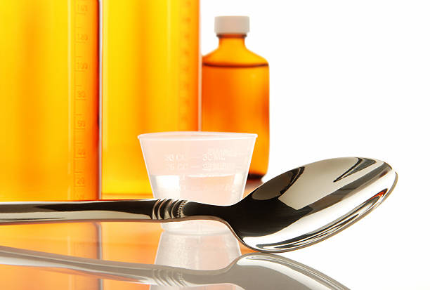 de medicamento frascos - cough medicine spoon medicine tablespoon imagens e fotografias de stock