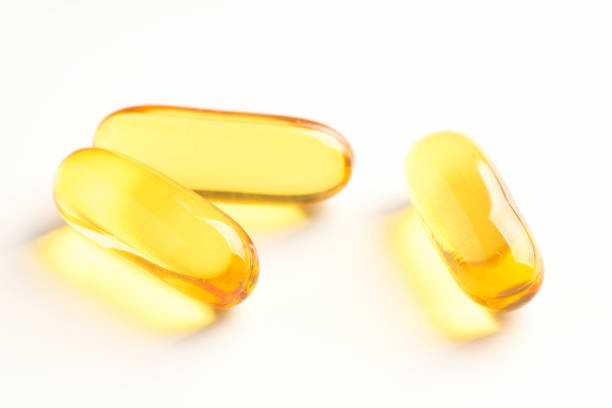 istock fish oil capsules isolated on white background 980422378