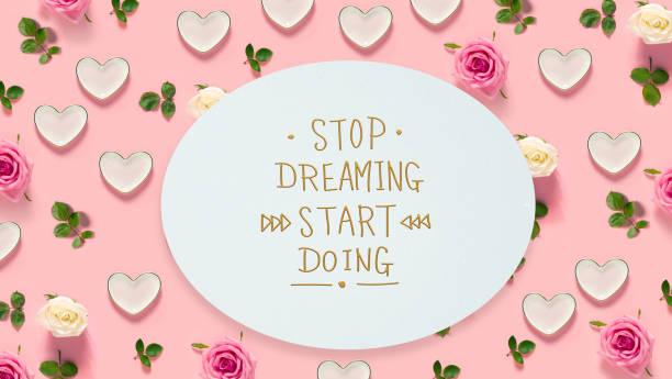 istock Stop Dreaming Start Doing message with roses and hearts 980427910