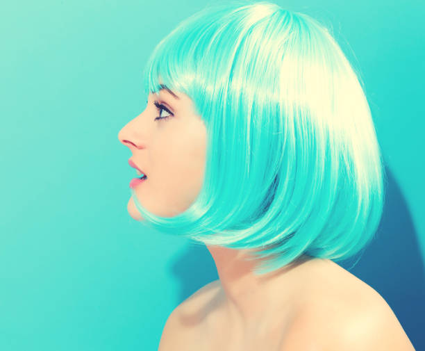 istock Beautiful woman in a bright blue wig 980427974