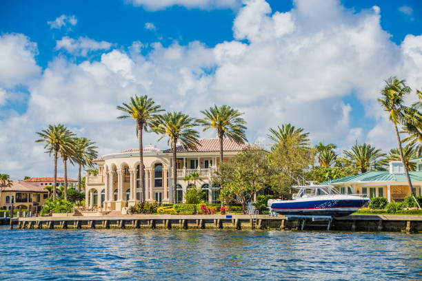 Yacht at Coastal Mansion stock photo