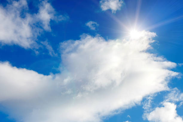 istock clouds against a blue sky with rays of the sun 980431798