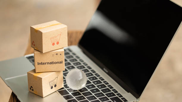 istock Idea of shopping online and service / e-commerce concept. Stack boxes on laptop for Customer can buy from electronic internet. 980432172