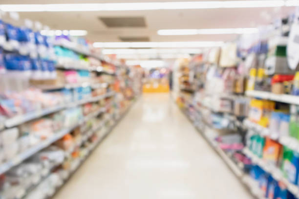 istock supermarket aisle with product on shelves blurred background 980433016