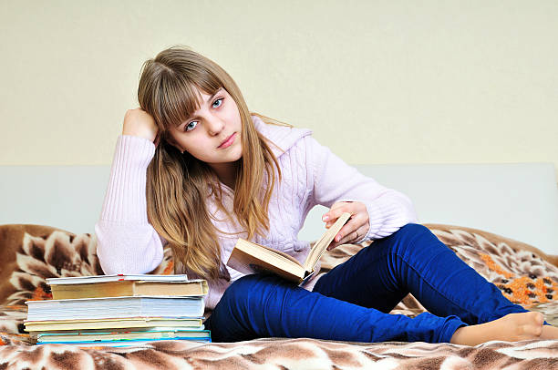 istock bored girl with books 98044117