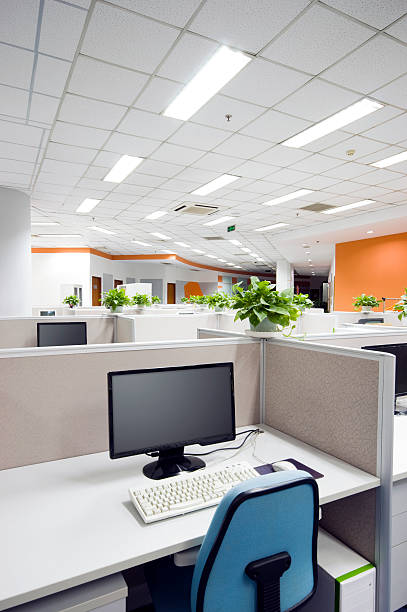 istock Computer and chair in a cubicle in an office workplace 98044123