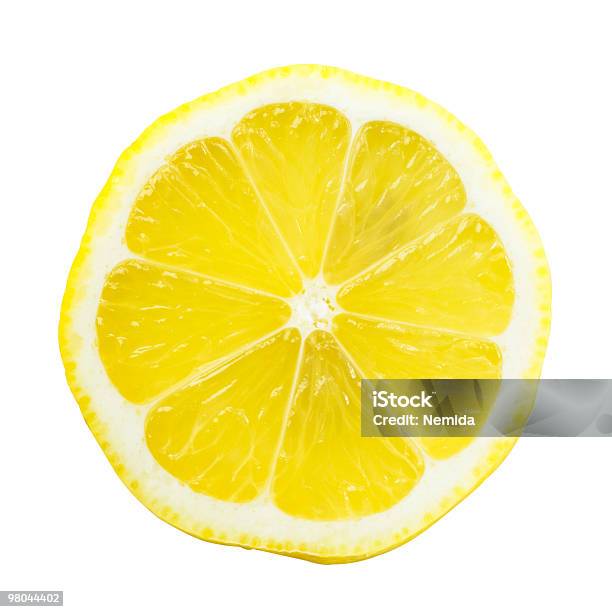 Lemon Slice Over White With A Bright Yellow Stock Photo - Download Image Now - Lemon - Fruit, Slice of Food, Citrus Fruit