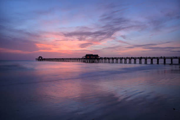 istock Pink and purple sunset over the Naples Pier 980461784