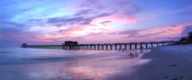 istock Pink and purple sunset over the Naples Pier 980461982