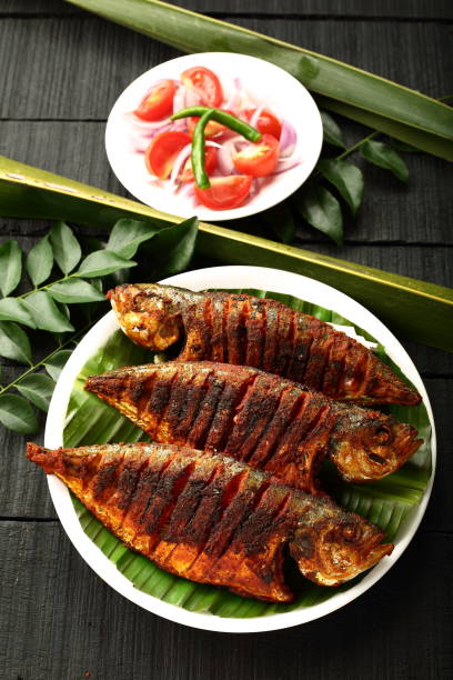 обжаренная морская еда - fish spice стоковые фото и изображения