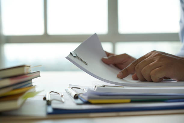 istock Businessman working reading documents graph financial to job succes Analyze document plans 980480452