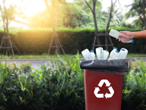 istock man hand putting plastic reuse for recycling concept environmental protection world recycle 980480548