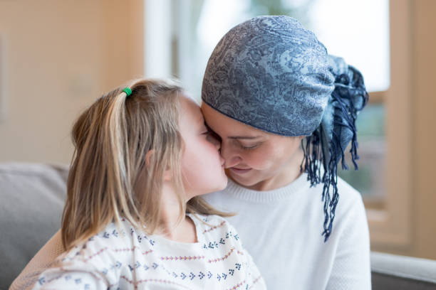 istock Young mom with cancer holds her daughter 980487738