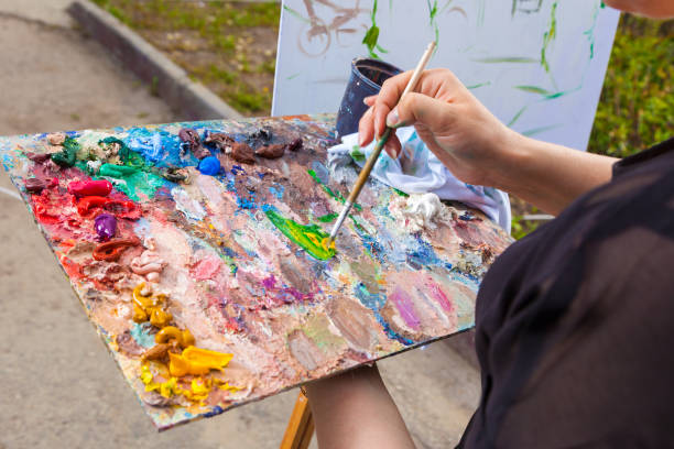 istock A close-up artist paints 980500032