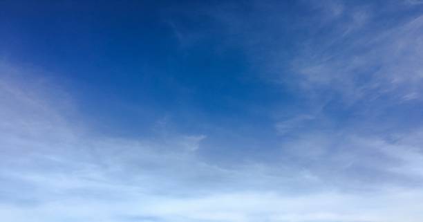 istock Beautiful clouds against a blue sky background. Cloud sky. Blue sky with clouds weather, nature cloud. White clouds, blue sky and sun. 980506112