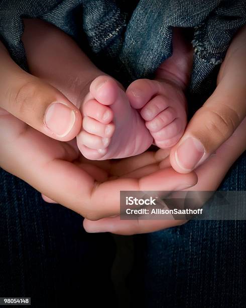 Hands And Feet In Jeans Stock Photo - Download Image Now - Baby - Human Age, Casual Clothing, Color Image