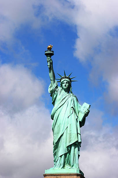 istock Statue of Liberty with dividing cloud 98054192