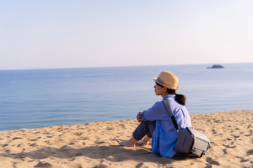 Women enjoys traveling in Tottori sand dunes in Japan