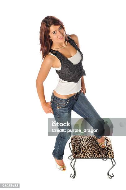 Attractive Young Woman On A Stool Stock Photo - Download Image Now - Adult, Adults Only, Casual Clothing