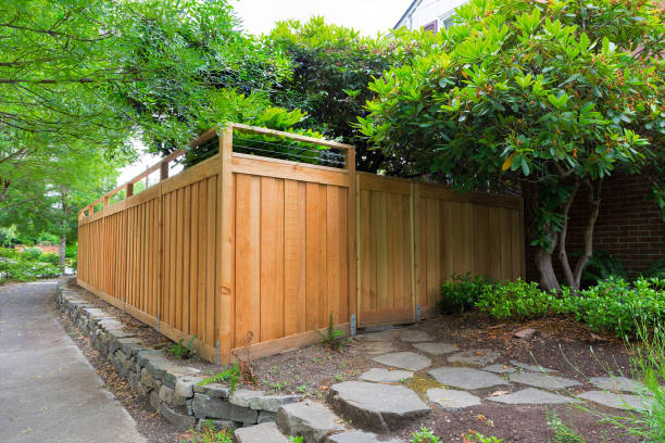 New Cedar Wood Fence around house side yard landscaping stock photo