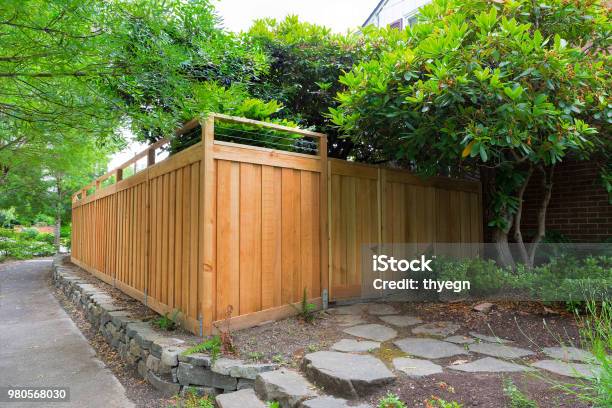 New Cedar Wood Fence Around House Side Yard Landscaping Stock Photo - Download Image Now