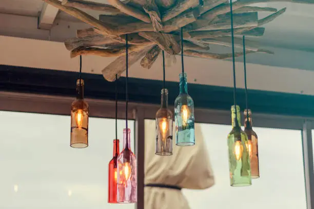 Photo of Magnificent retro light lamp decor made of colored wine bottles