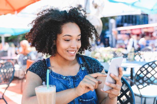 istock woman drinking cocktail outdoors 980615306