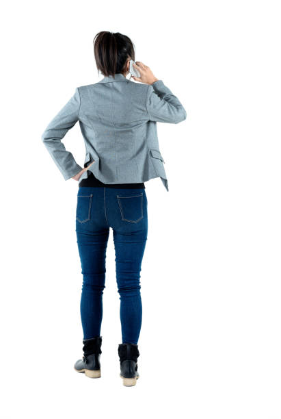 istock Busy businesswoman standing and using phone 980618308