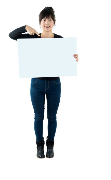 istock Smiling woman with a blank board 980623580