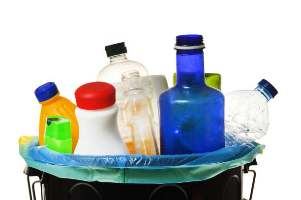 istock garbage bin full of bottles to recycle on white 980623940