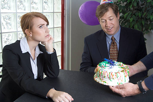 istock Co-worker Annoyed at a Birthday Cake 98062400