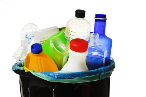 istock garbage bin full of bottles to recycle on white 980624004
