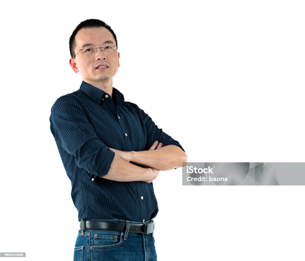 Man standing with arms crossed Man standing with arms crossed. Men Stock Photo