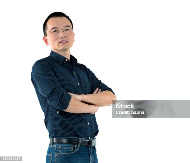 Man Standing With Arms Crossed Stock Photo - Download Image Now - Men, Arms Crossed, Contemplation