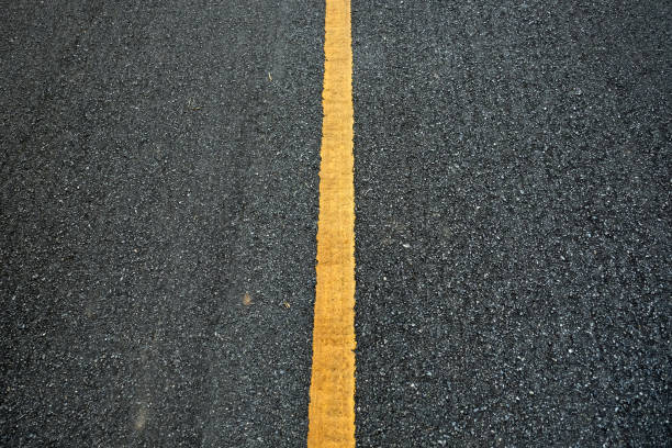 istock New asphalt texture with yellow line on road 980626610