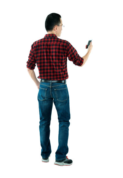 istock Rear view of man using mobile phone 980626984