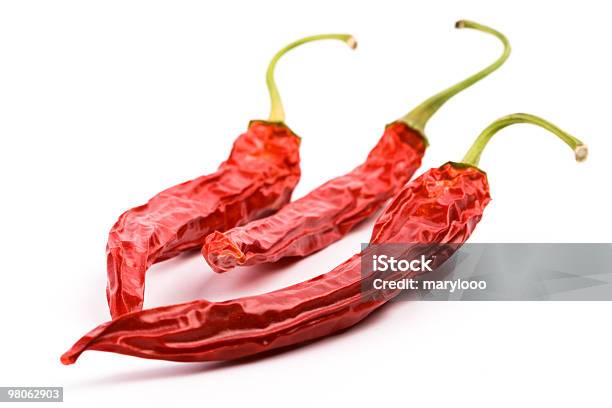 Three Dry Red Chili Peppers Stock Photo - Download Image Now - Bright, Cayenne Pepper, Chili Pepper