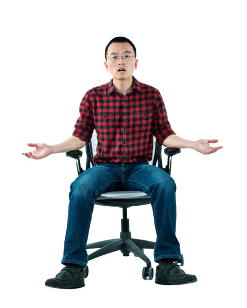 istock Man sitting on office chair with arms outstretched 980633090