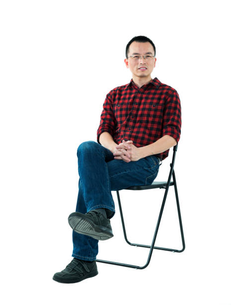 Two Empty White Folding Chairs Face to Face