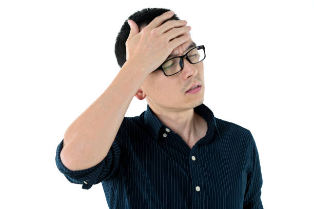 istock Businessman with a headache on white background 980634190